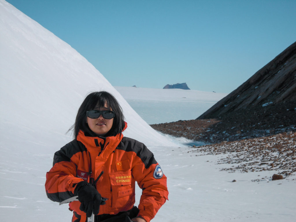 A woman (Wei Lijie) stood on a glacier