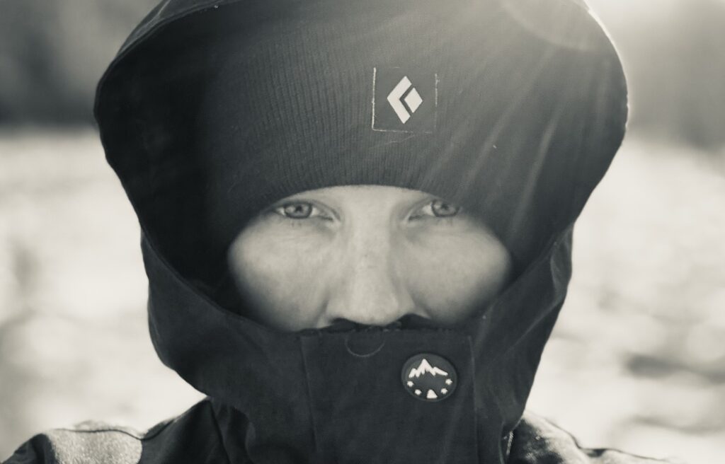 A pciture of Sari's face, with polar gear and in black and white.