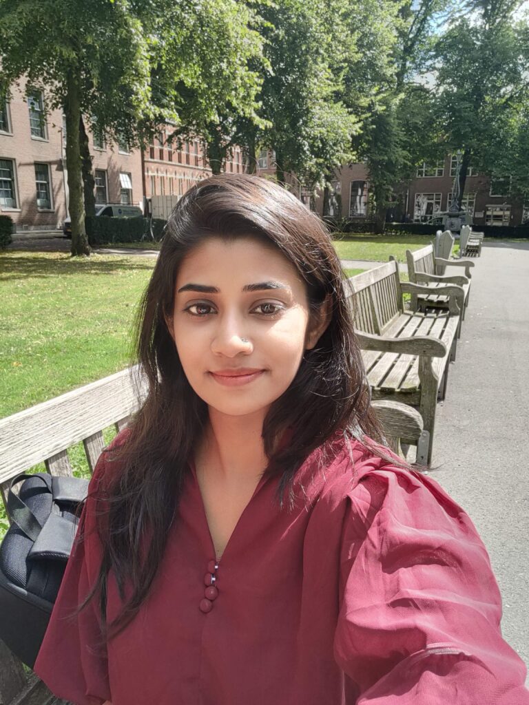 A picture of Silpa in a burgundy-coloured top